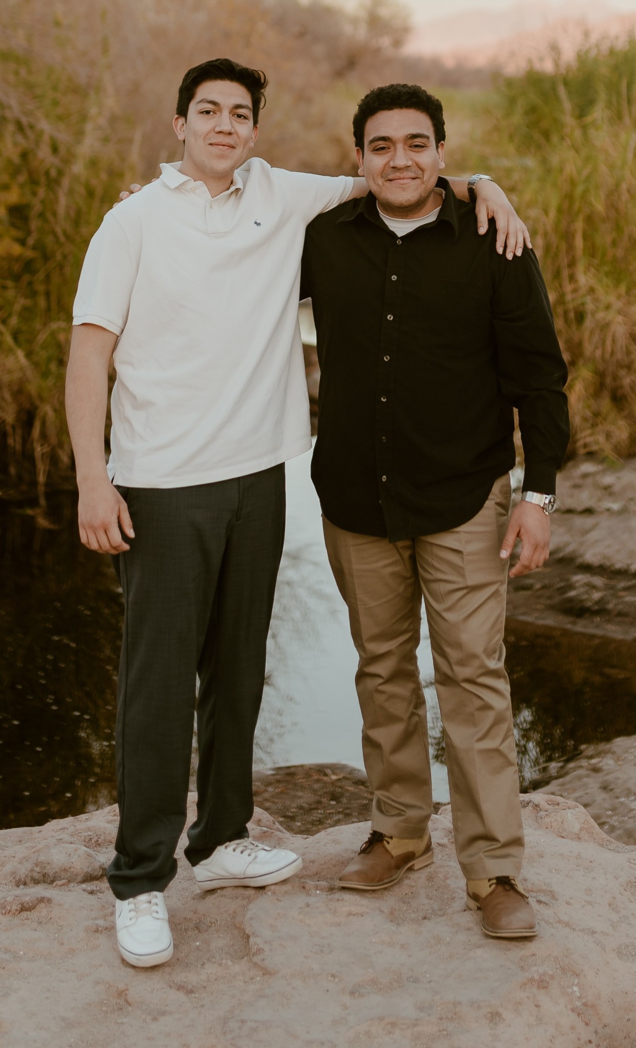Ricardo and Daniel, the brothers who founded Tito Tintz, standing together outdoors